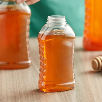11 oz. (16 oz. Honey Weight) Ribbed Hourglass PET Honey Bottle - 295/Case