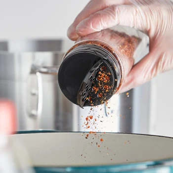 63/485 Black Dual-Flapper Induction-Lined Spice Lid with 7 Holes - 575/Case