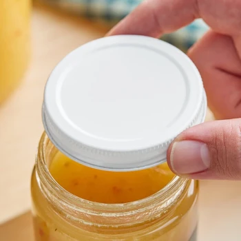 63/400 White Metal Lid with Plastisol Liner - 1,300/Case