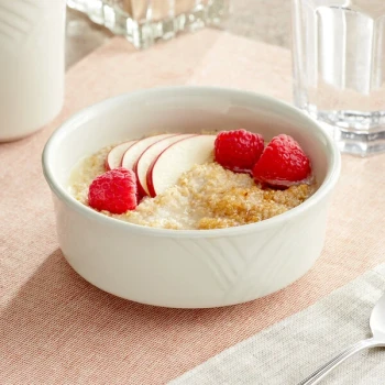 Acopa Swell 11 oz. Ivory (American White) Embossed Stoneware Cereal Bowl - 36/Case