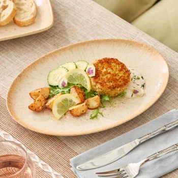 Acopa Cape 11 1/8" x 7 3/4" Oval Dune Beige Porcelain Platter - 12/Case