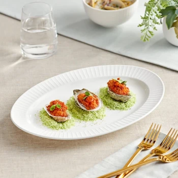 Acopa Cordelia 12 3/4" x 9" Bright White Embossed Wide Rim Porcelain Platter - 12/Case