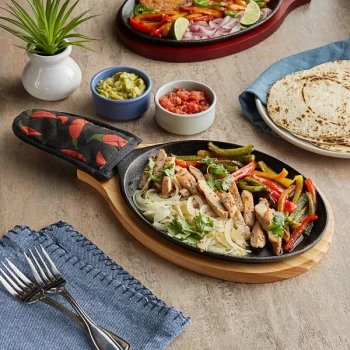 Choice 9 1/4" x 7" Oval Pre-Seasoned Cast Iron Fajita Skillet with Natural Finish Wood Underliner and Chili Pepper Cotton Handle Cover