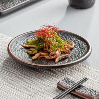 Acopa Heika 6" Black Matte Textured Coupe Stoneware Plate - 12/Case