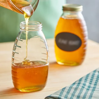 12 oz. (16 oz. Honey Weight) Classic Queenline Glass Honey Jar - 12/Case