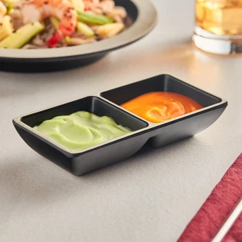 Acopa Ugoki 4 oz. Matte Black Two Compartment Melamine Sauce Dish with Ivory Rim - 12/Pack