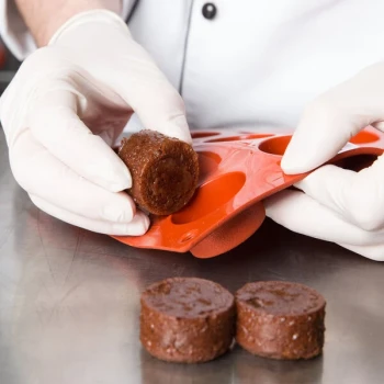 Matfer Bourgeat 257916 Gastroflex Orange Silicone 15 Compartment Round Petit Fours Mold - 1 1/2 inch x 3/4 inch