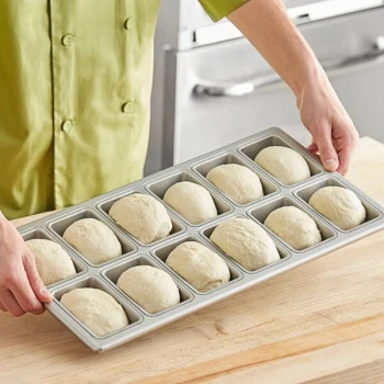 Baker's Lane 12 Compartment Glazed Aluminized Steel Mini Bread Pan - 6 oz. Capacity, 4 inch x 2 1/2 inch x 1 1/4 inch Cavities
