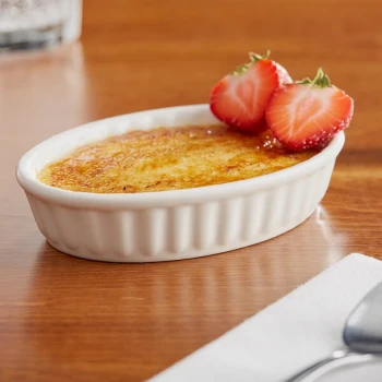 Acopa 5 oz. Oval Ivory Fluted Porcelain Souffle / Creme Brulee Dish - 36/Case