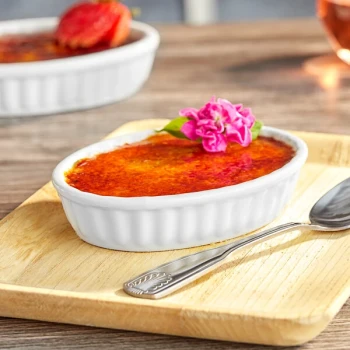 Acopa 5 oz. Oval Bright White Fluted Porcelain Souffle / Creme Brulee Dish - 12/Pack