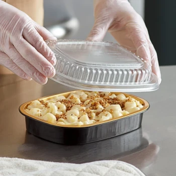 Choice Heavy Duty Smoothwall Black and Gold Small Oblong Foil Take-Out Pan with Dome Lid 23.3 oz. - 25/Pack