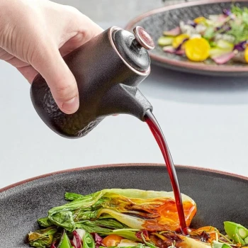 Acopa Heika 3.7 oz. Black Matte Textured Stoneware Soy Sauce Pourer - 12/Case