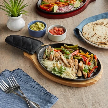 Choice 9 1/4" x 7" Oval Pre-Seasoned Cast Iron Fajita Skillet with Natural Finish Wood Underliner and Black Cotton Handle Cover